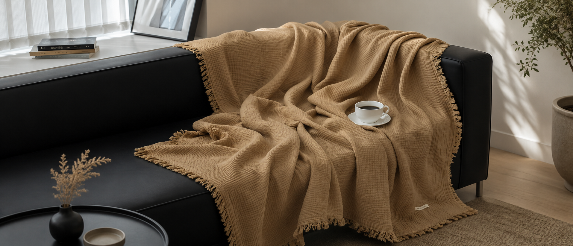 Soft throw blanket styled across a modern sofa